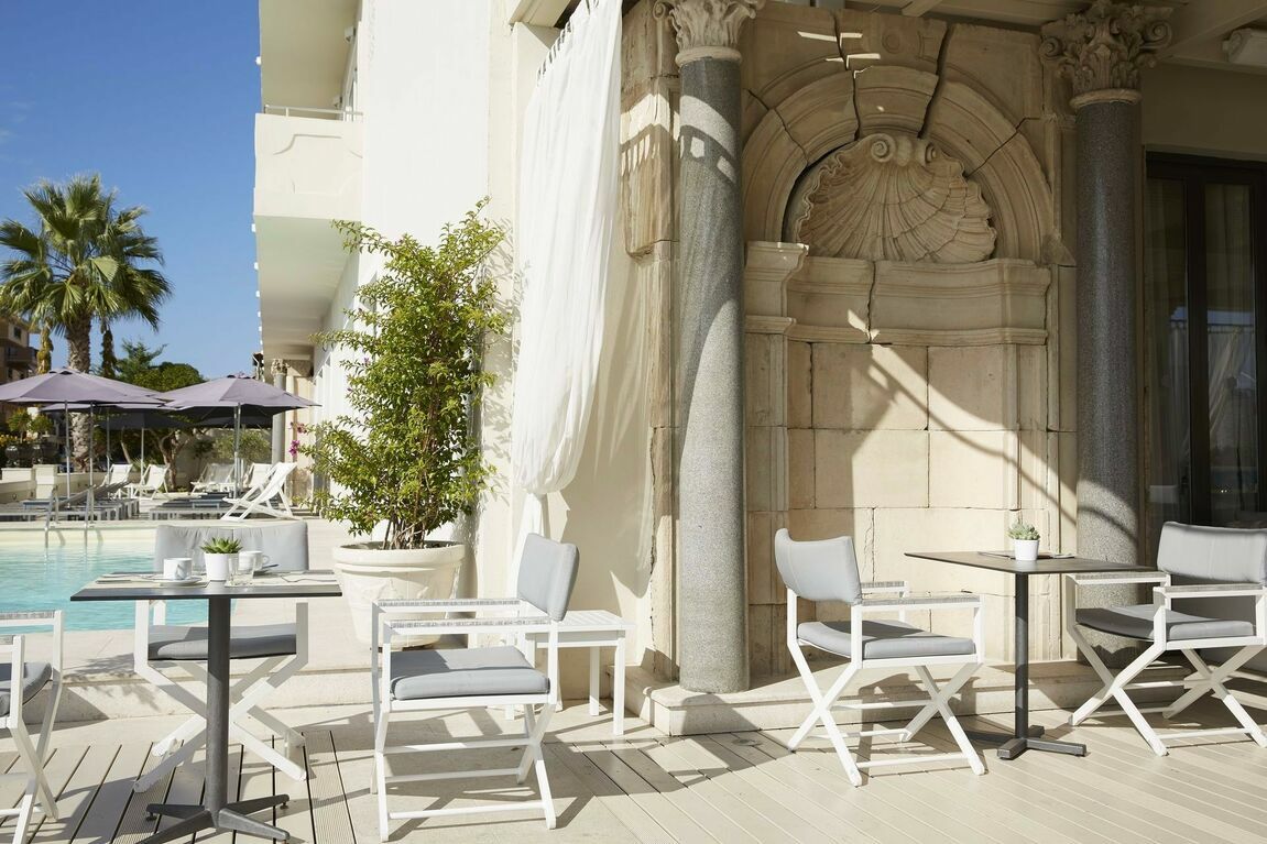 Elegant setup of the main restaurant of our Corfu town hotel of 4 star appeal